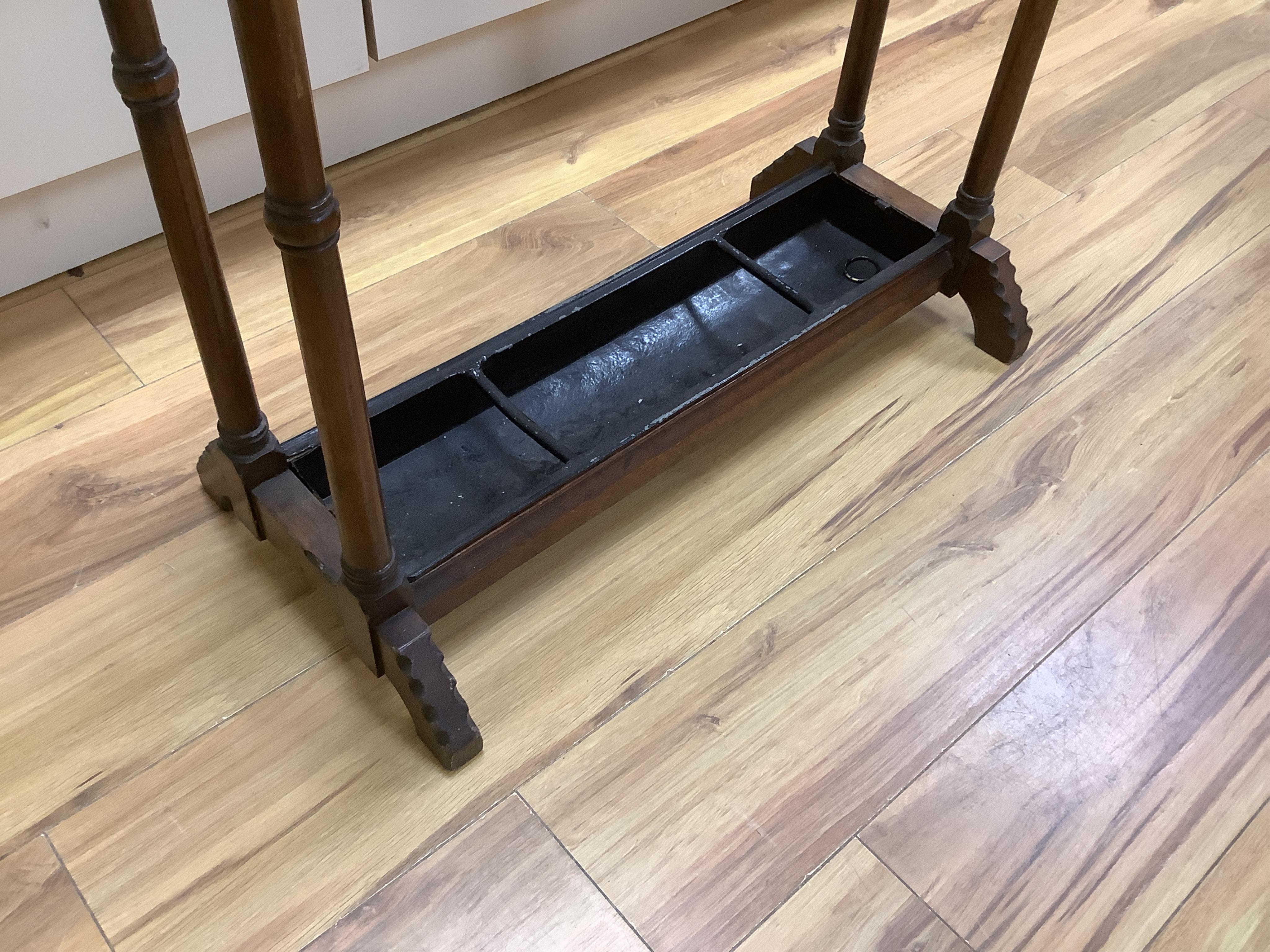 An Arts & Crafts oak umbrella stand and various walking sticks including two silver mounted. Condition - varies
